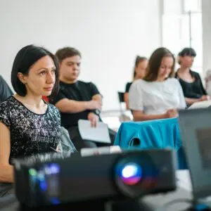 a group of people sitting at computers